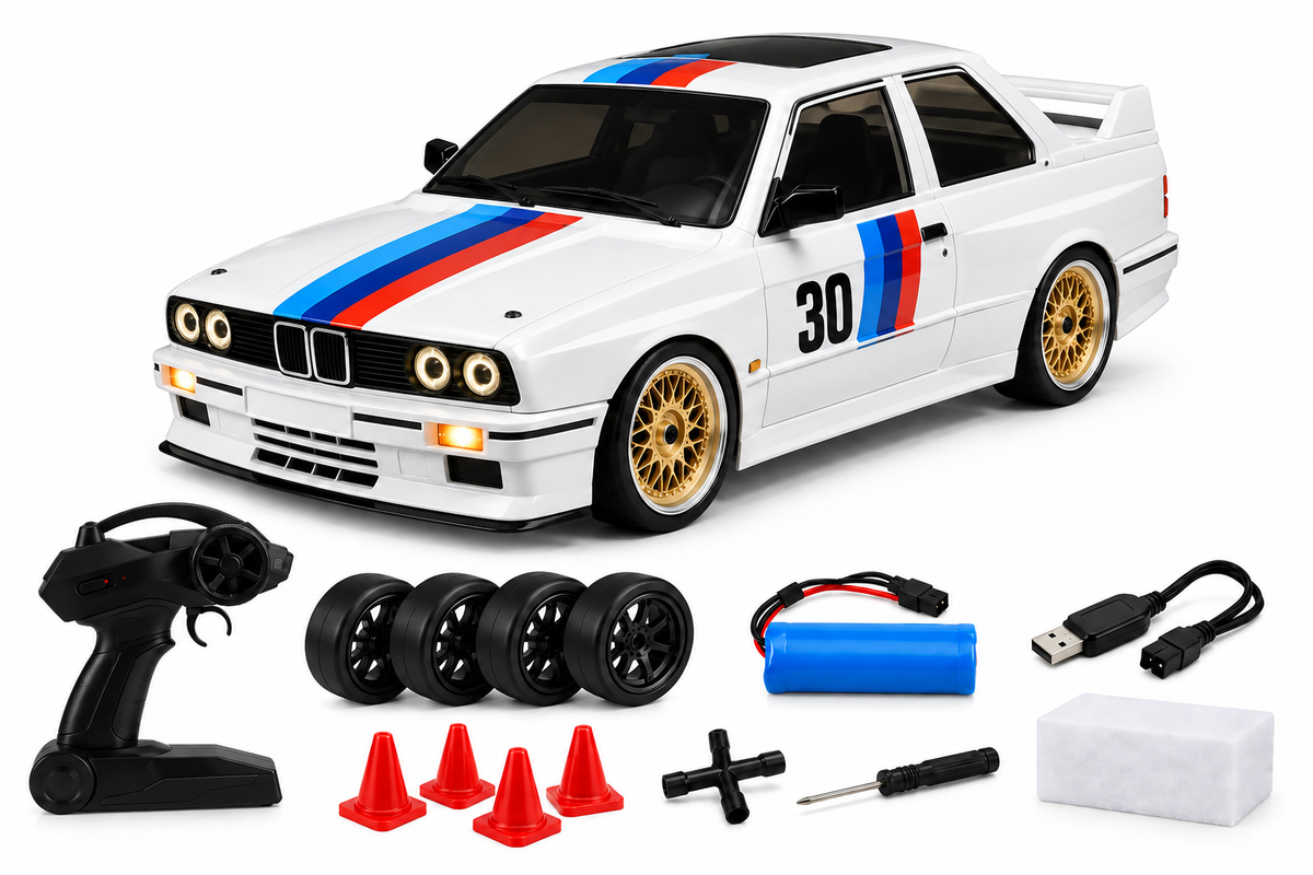 Contenu de la boîte du Drift Origin : voiture, radiocommande, quatre roues drift, batterie, câble USB, plots, clé et tournevis