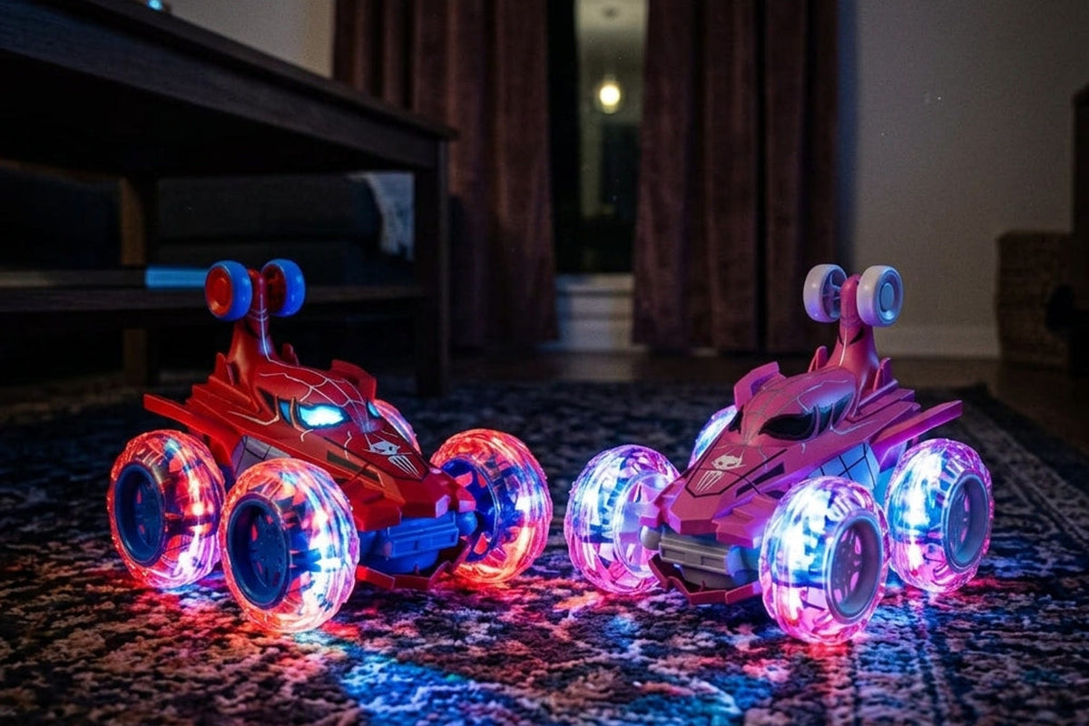 Les deux Arachno araignée, la rouge et la rose, roues à LED allumées sur un tapis dans le noir