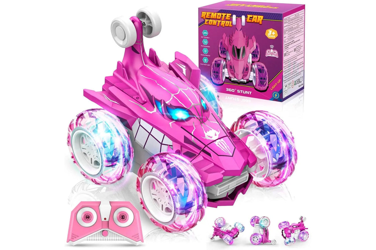 Voiture télécommandée cascadeuse Arachno araignée rose et violette devant sa boîte, avec sa manette rose